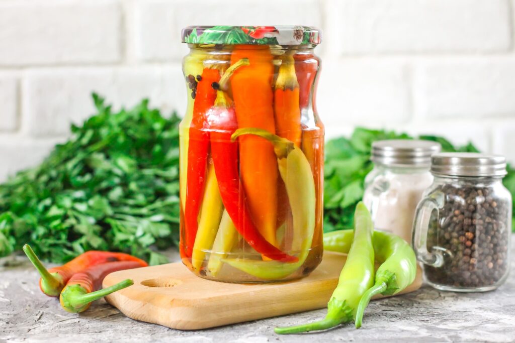 colorful pickled peppers - peppercorns - cilantro
